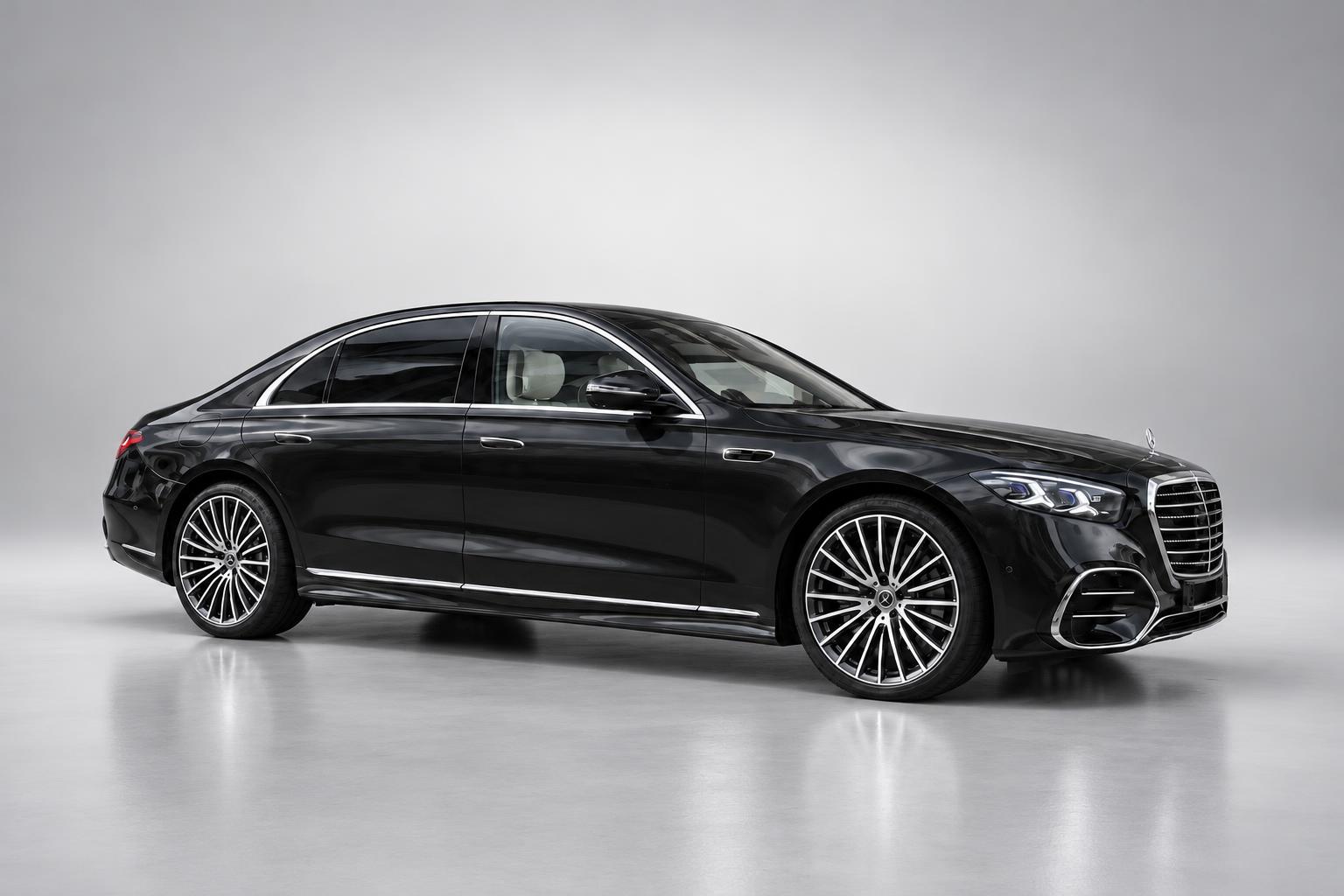 Black 2026 Mercedes-Benz S-Class saloon photographed on a neutral studio background